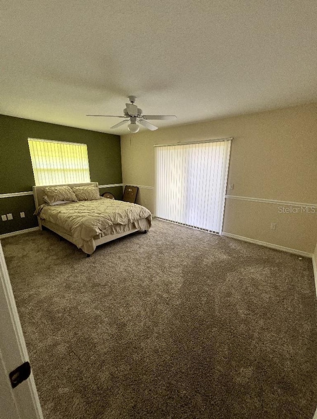 2528 Deerbrook Dr, Lakeland, FL 33811 - bedroom with carpet floors, a textured ceiling, ceiling fan, and baseboards