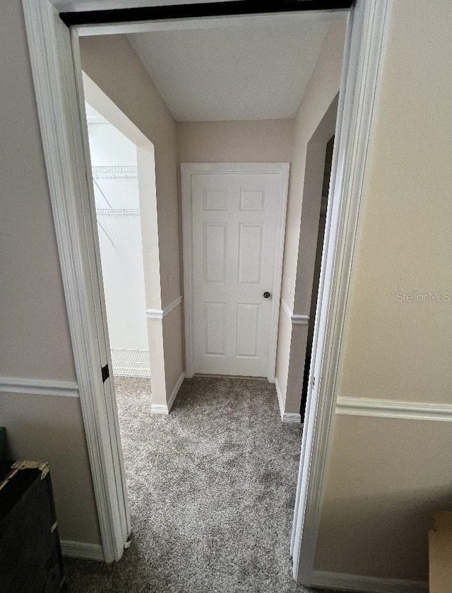 2528 Deerbrook Dr, Lakeland, FL 33811 - corridor featuring carpet floors and baseboards