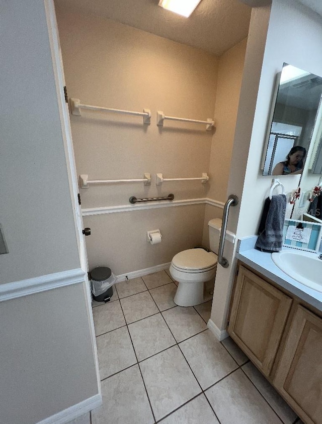 2528 Deerbrook Dr, Lakeland, FL 33811 - bathroom featuring toilet, vanity, and tile patterned floors