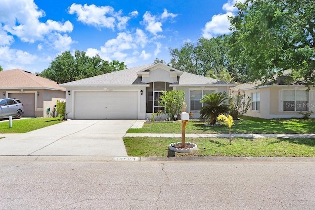 13523 Prestwick Dr, Riverview, FL 33579 - ranch-style house featuring driveway, a garage, a front lawn, and stucco siding