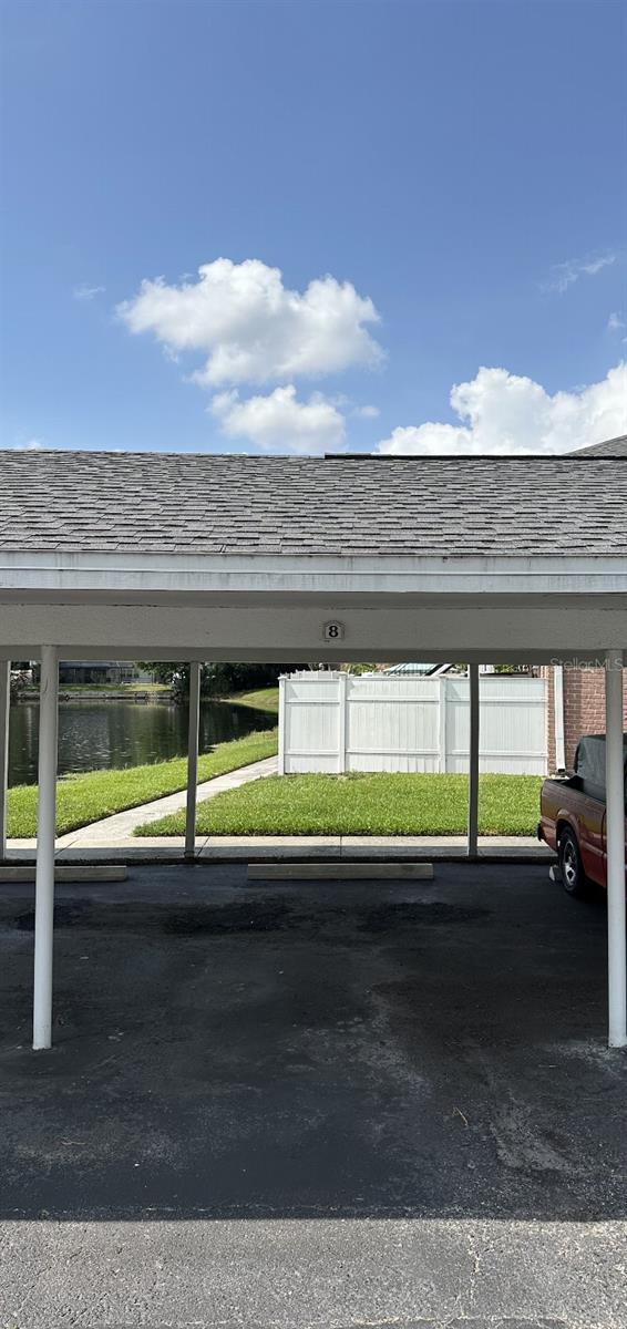 2557 Cedar Cypress Ct, Tampa, FL 33618 - covered parking lot with a water view