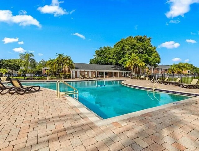 2557 Cedar Cypress Ct, Tampa, FL 33618 - community pool featuring a patio area