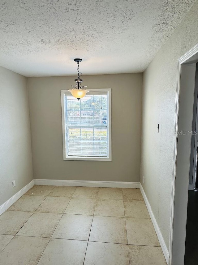 2557 Cedar Cypress Ct, Tampa, FL 33618 - unfurnished dining area featuring a textured ceiling and light tile patterned floors