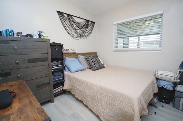 bedroom with light wood-type flooring