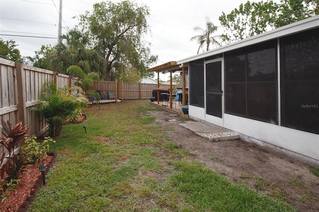 view of yard with a sunroom