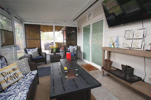 sunroom with an outdoor living space