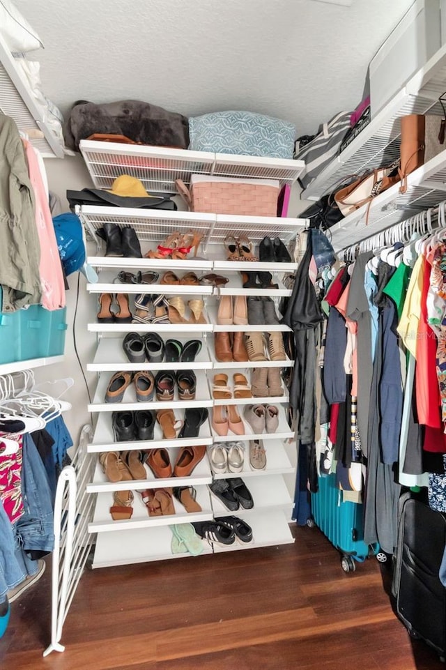 spacious closet with wood finished floors