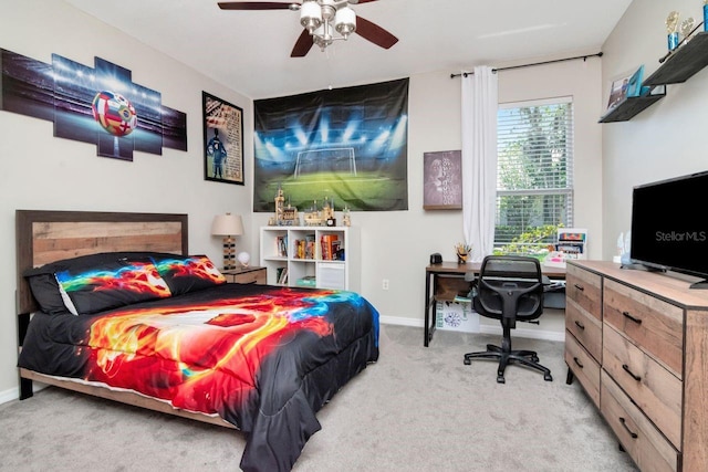 bedroom featuring light carpet, baseboards, and ceiling fan