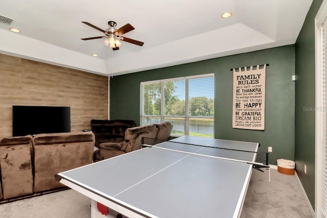 playroom featuring a tray ceiling, carpet floors, baseboards, a ceiling fan, and recessed lighting