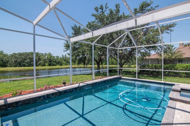 view of pool featuring a water view, glass enclosure, and view of scattered trees
