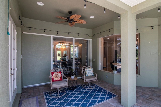 view of patio featuring ceiling fan