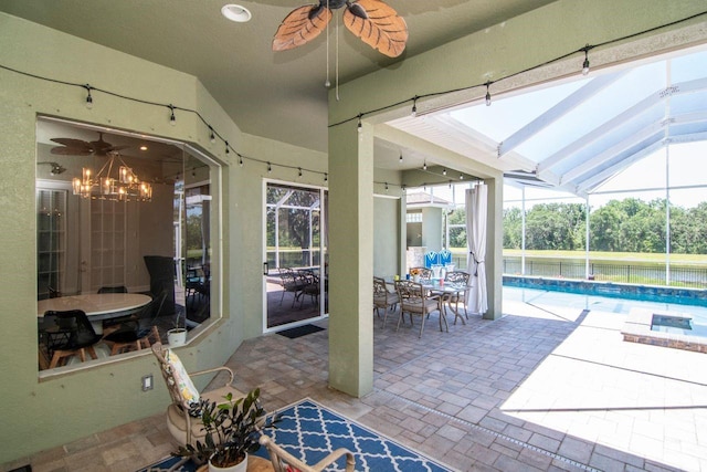 view of patio featuring a ceiling fan, an outdoor pool, and a lanai