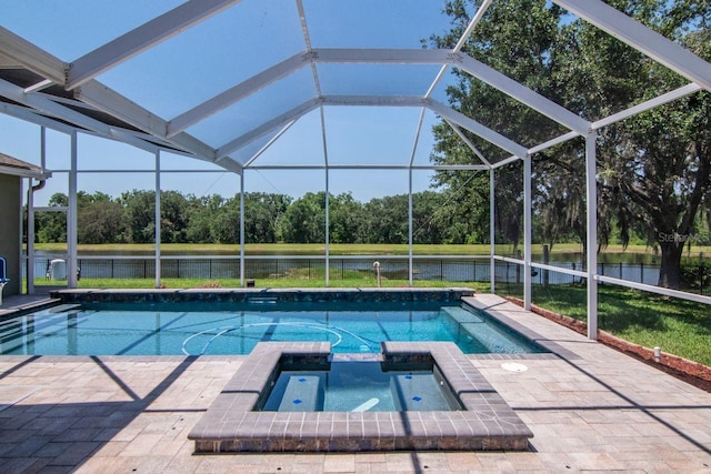 view of pool with a water view, view of scattered trees, a pool with connected hot tub, and a lanai
