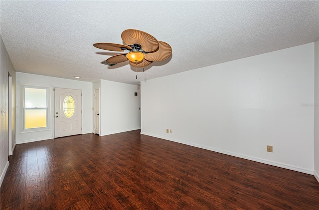10051 82nd Ln, Seminole, FL 33777 - unfurnished living room with wood finished floors, baseboards, a textured ceiling, and a ceiling fan