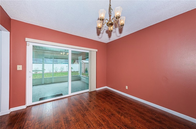 10051 82nd Ln, Seminole, FL 33777 - spare room featuring a chandelier, baseboards, and wood finished floors