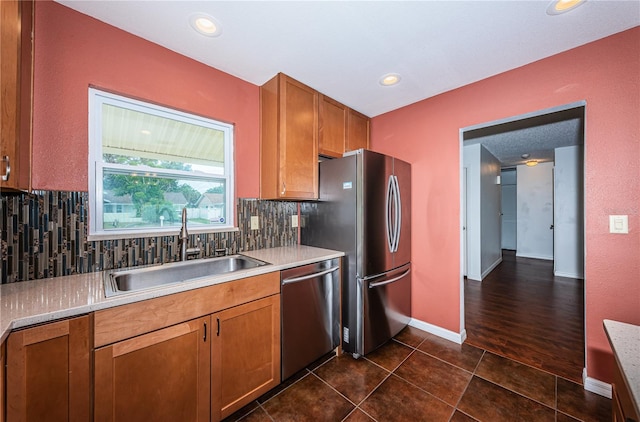 10051 82nd Ln, Seminole, FL 33777 - kitchen featuring stainless steel appliances, a sink, brown cabinetry, light countertops, and recessed lighting