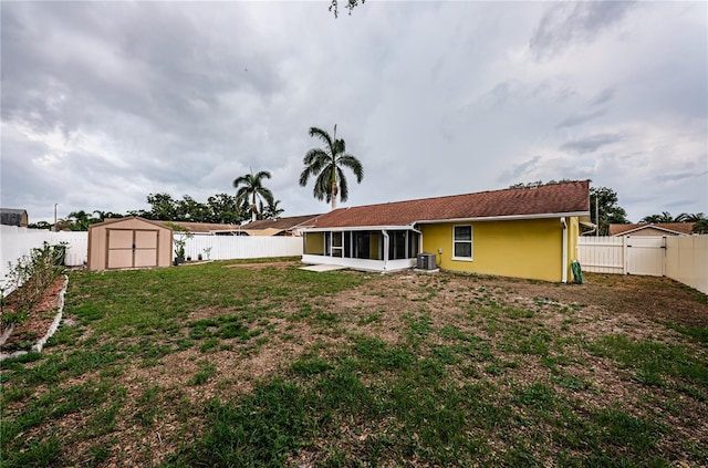 10051 82nd Ln, Seminole, FL 33777 - rear view of house with a sunroom, central AC unit, and stucco siding