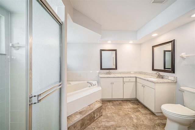 3305 Blythe Ave, Spring Hill, FL 34609 - bathroom with toilet, a bath, a stall shower, double vanity, and recessed lighting