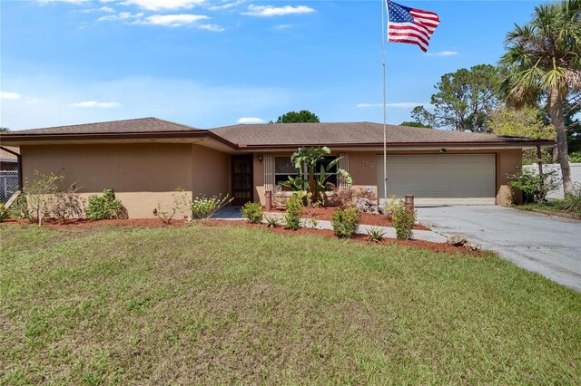 1716 Bayou Cir, Lakeland, FL 33803 - ranch-style home featuring stucco siding, a garage, concrete driveway, and a front lawn
