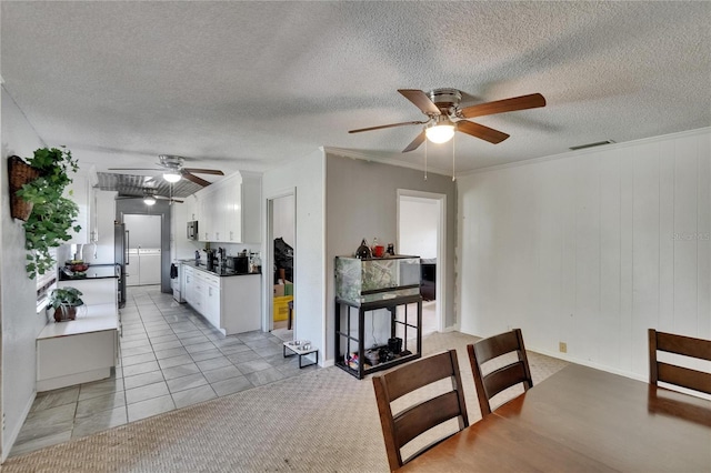 1716 Bayou Cir, Lakeland, FL 33803 - dining area featuring ceiling fan, a textured ceiling, and light tile patterned flooring