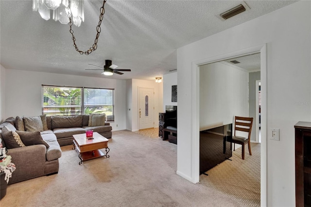 1716 Bayou Cir, Lakeland, FL 33803 - carpeted living room with a textured ceiling, ceiling fan, and baseboards