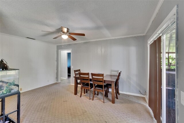 1716 Bayou Cir, Lakeland, FL 33803 - dining room with carpet, ornamental molding, a textured ceiling, ceiling fan, and baseboards