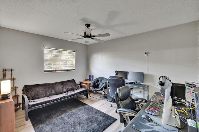 1716 Bayou Cir, Lakeland, FL 33803 - home office featuring ceiling fan, a textured ceiling, and wood finished floors