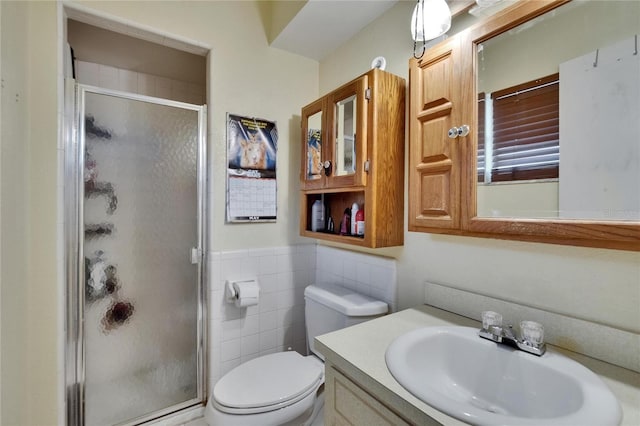 1716 Bayou Cir, Lakeland, FL 33803 - full bathroom with a stall shower, toilet, tile walls, vanity, and a wainscoted wall