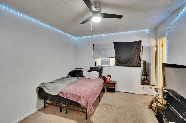 1716 Bayou Cir, Lakeland, FL 33803 - bedroom featuring a textured ceiling, carpet floors, cooling unit, baseboards, and ceiling fan
