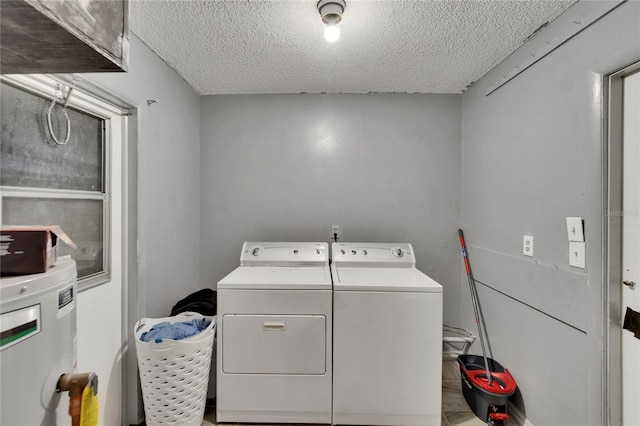 1716 Bayou Cir, Lakeland, FL 33803 - washroom with a textured ceiling, washer and clothes dryer, and water heater