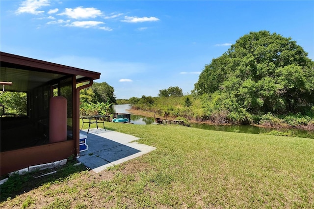 1716 Bayou Cir, Lakeland, FL 33803 - view of green lawn with a patio area and a water view