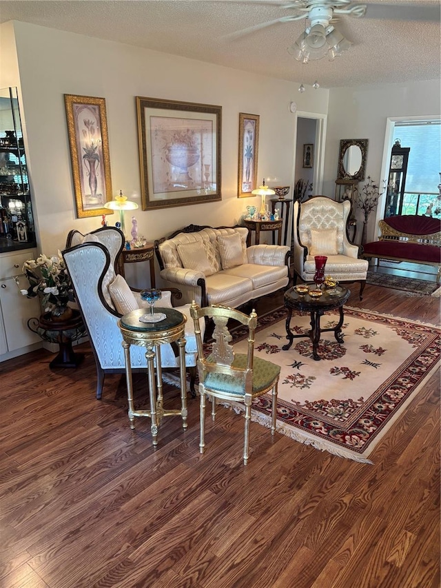 9302 Trowbridge Ct, New Port Richey, FL 34655 - living area with wood finished floors, ceiling fan, and a textured ceiling