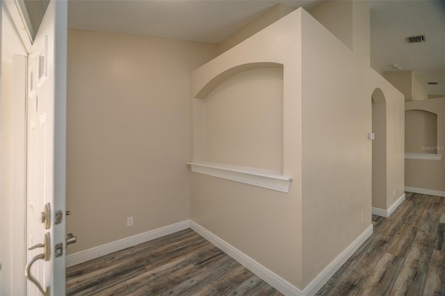 19247 Otters Wick Way, Land O Lakes, FL 34638 - hallway featuring wood finished floors, baseboards, and arched walkways