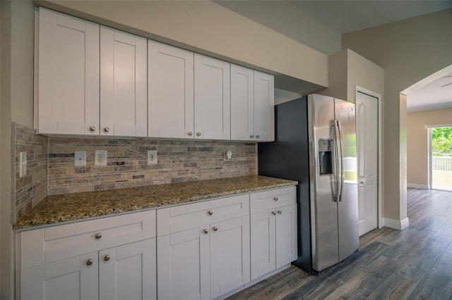 19247 Otters Wick Way, Land O Lakes, FL 34638 - kitchen with stainless steel fridge, dark wood-style floors, white cabinetry, and baseboards