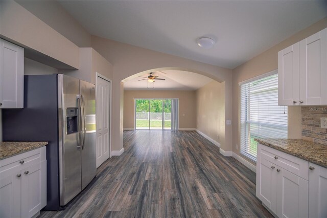 19247 Otters Wick Way, Land O Lakes, FL 34638 - kitchen featuring stainless steel fridge, arched walkways, dark wood-style floors, ceiling fan, and baseboards