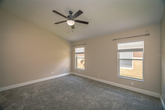 19247 Otters Wick Way, Land O Lakes, FL 34638 - spare room with a ceiling fan, dark carpet, and baseboards