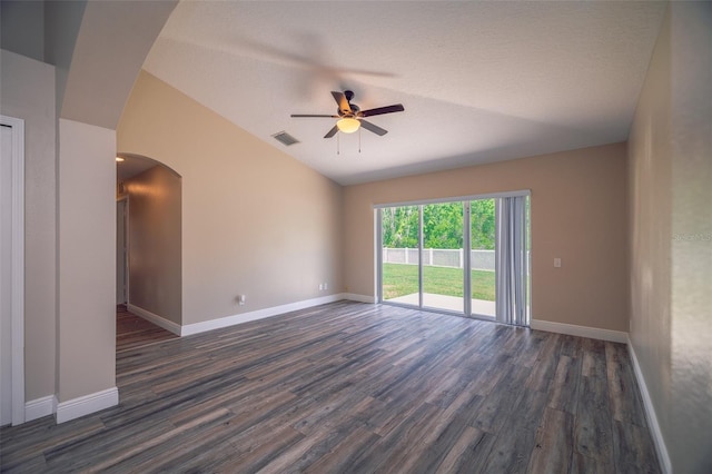19247 Otters Wick Way, Land O Lakes, FL 34638 - unfurnished room with lofted ceiling, ceiling fan, dark wood-style flooring, arched walkways, and baseboards