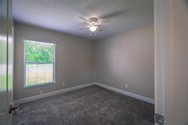 19247 Otters Wick Way, Land O Lakes, FL 34638 - empty room featuring a ceiling fan, a textured ceiling, dark colored carpet, and baseboards