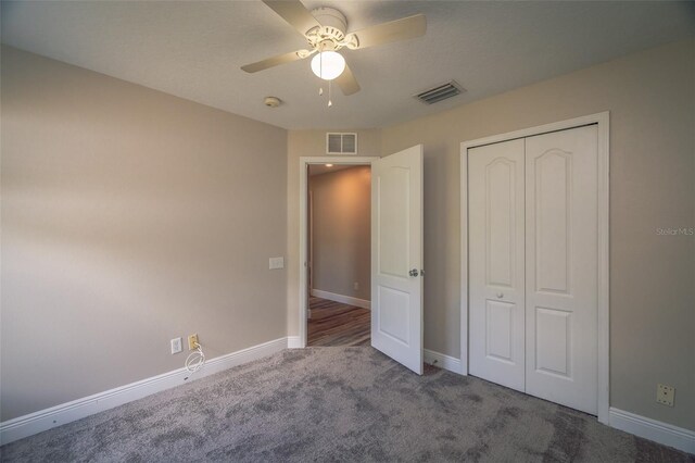 19247 Otters Wick Way, Land O Lakes, FL 34638 - unfurnished bedroom with carpet floors, baseboards, a closet, and ceiling fan
