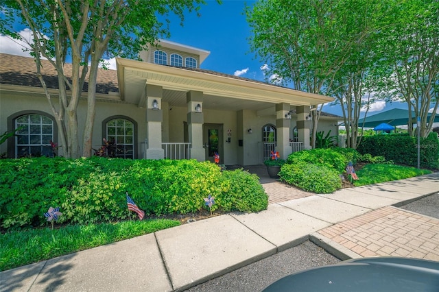 19247 Otters Wick Way, Land O Lakes, FL 34638 - view of front of property featuring stucco siding and covered porch