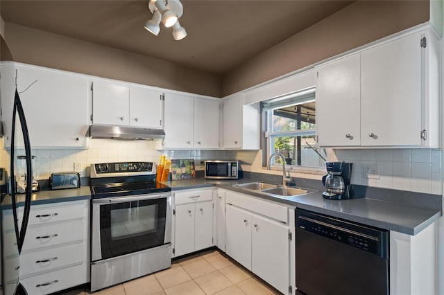 2048 64th Ave S, Saint Petersburg, FL 33712 - kitchen with stainless steel appliances, under cabinet range hood, a sink, and dark countertops