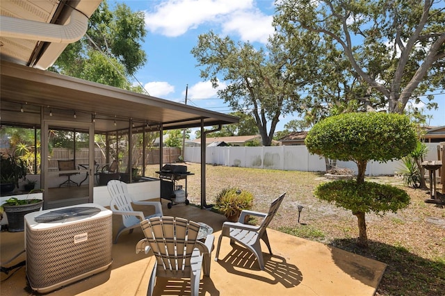 2048 64th Ave S, Saint Petersburg, FL 33712 - fenced backyard featuring central AC, area for grilling, and a patio