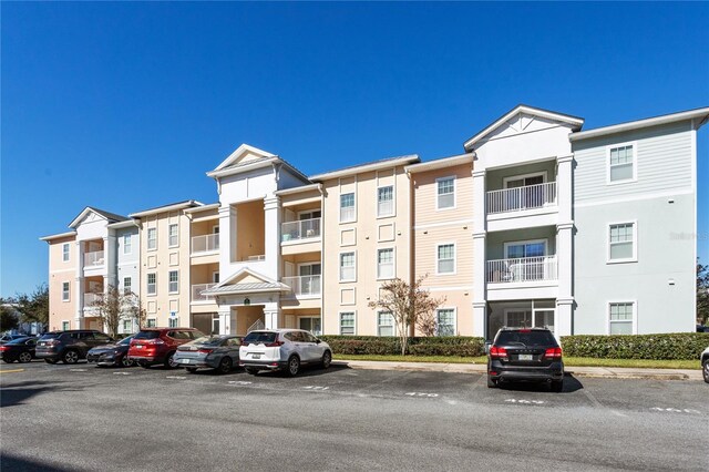 4991 Key Lime Dr Unit 104, Jacksonville, FL 32256 - view of apartment building / complex featuring uncovered parking