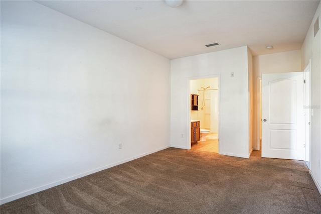 4991 Key Lime Dr Unit 104, Jacksonville, FL 32256 - unfurnished bedroom with carpet floors, baseboards, and ensuite bathroom