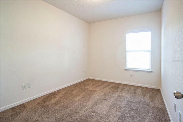 4991 Key Lime Dr Unit 104, Jacksonville, FL 32256 - empty room with carpet and baseboards