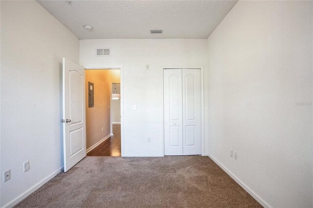 4991 Key Lime Dr Unit 104, Jacksonville, FL 32256 - unfurnished bedroom featuring carpet floors, electric panel, a closet, and baseboards