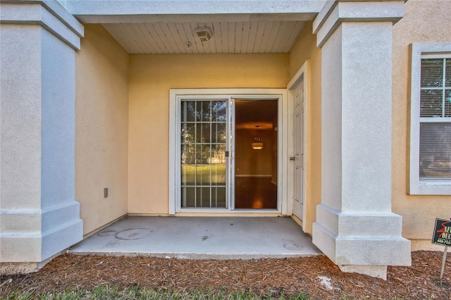 4991 Key Lime Dr Unit 104, Jacksonville, FL 32256 - entrance to property featuring stucco siding and a patio