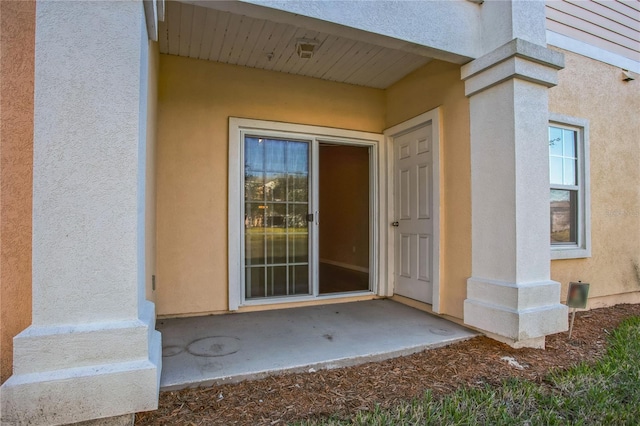 4991 Key Lime Dr Unit 104, Jacksonville, FL 32256 - entrance to property featuring stucco siding and a patio