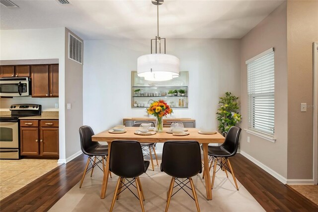 4991 Key Lime Dr Unit 104, Jacksonville, FL 32256 - dining area featuring wood finished floors and baseboards