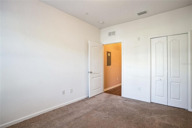 4991 Key Lime Dr Unit 104, Jacksonville, FL 32256 - unfurnished bedroom featuring carpet flooring, baseboards, electric panel, and a closet